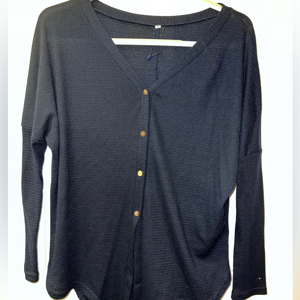 long sleeve navy blue shirt with a tie in the front